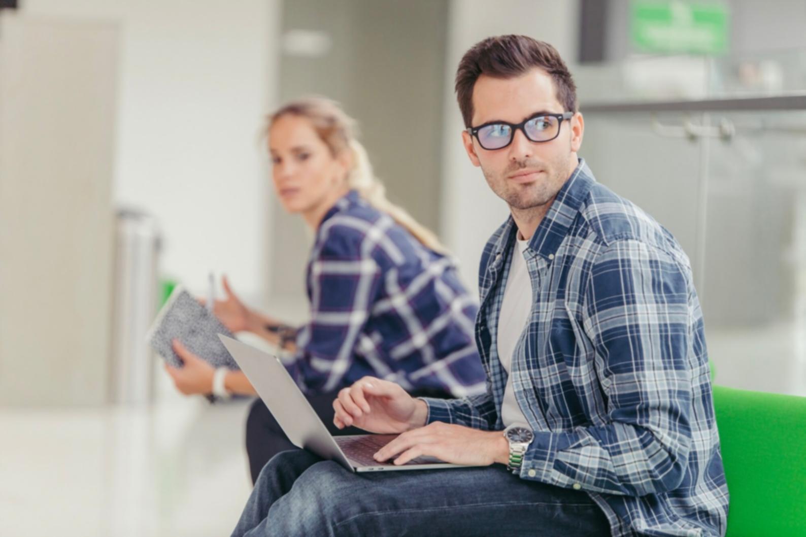 Financial analyst reviewing valuation models on multiple screens